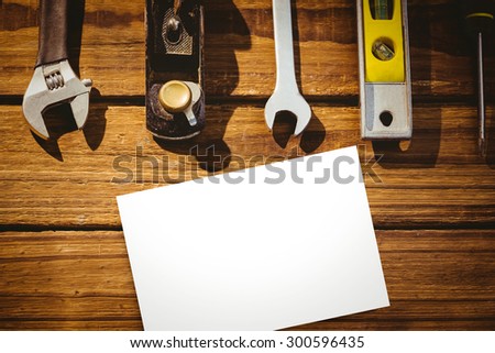 White card against tools on desk