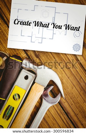 The word create what you want and blueprint against white card
