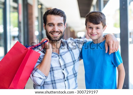 Portrait of a father and his son at the mall