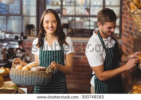 Portrait of happy co-workers working with a smile at the coffee shop