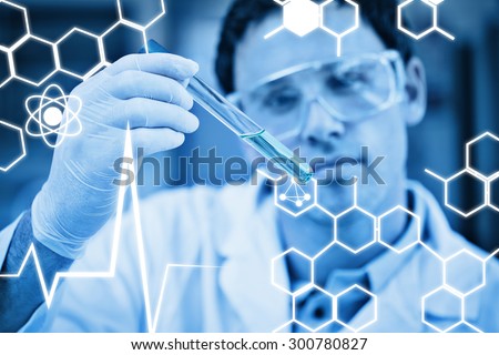 Science graphic against scientist analyzing green solution in test tube at the lab