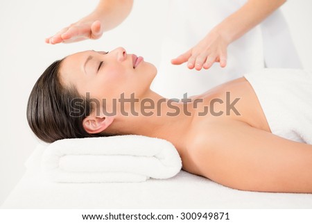 Young woman receiving alternative therapy at health spa
