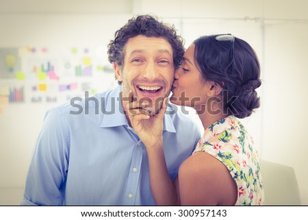 Portrait of a smiling casual young couple at work in the office
