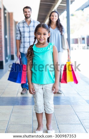 Happy family with shopping bags at the mall