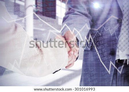 People in suit shaking hands against stocks and shares