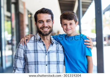 Portrait of a son and a father at the mall