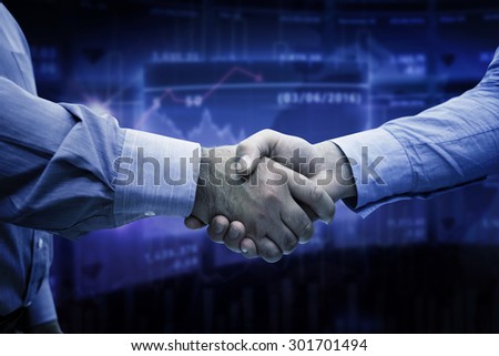 Men shaking hands against stocks and shares