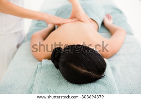 Close up of a beautiful brunette on massage table