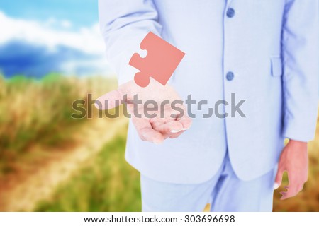 Handsome businessman gesturing with hands against blue sky over sand dunes Handsome businessman gesturing with hands on a white background