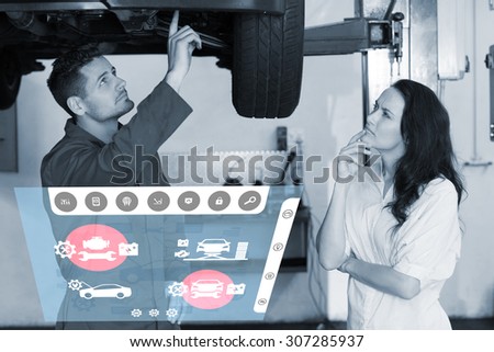 Engineering interface against mechanic showing customer the problem with car
