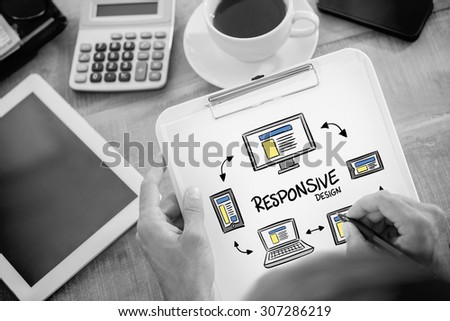 Man writing on clipboard on working desk against responsive design doodle