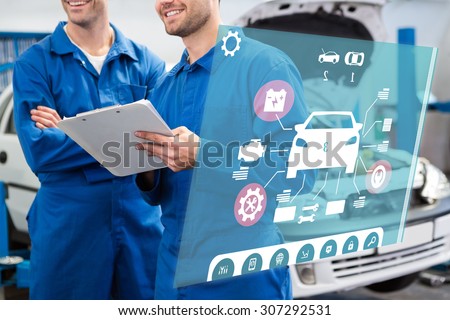 Engineering interface against smiling mechanic working together on clipboard