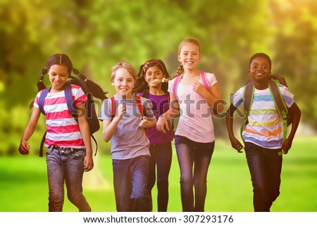 School kids running in school corridor against trees and meadow