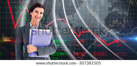 Businesswoman holding folders against stocks and shares