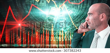 businessman calling on the phone against stocks and shares