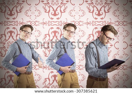 Nerd with notebook against elegant patterned wallpaper in blue and cream