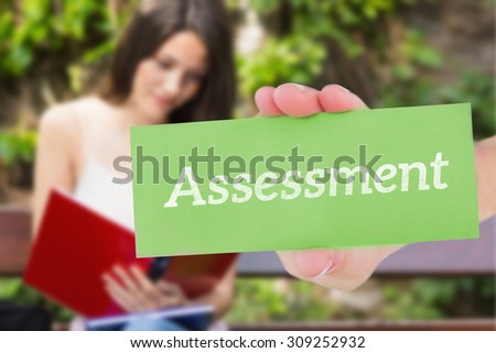 The word assessment and hand showing card against pretty student studying outside on campus