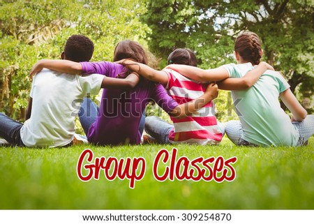The word group classes against children sitting with arms around at park
