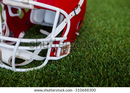Close up view of an american football helmet on the field