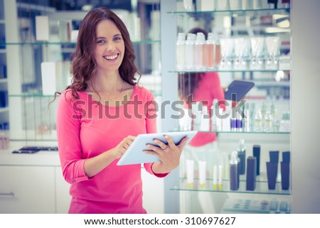 Pretty woman shopping for cosmetics at the pharmacy