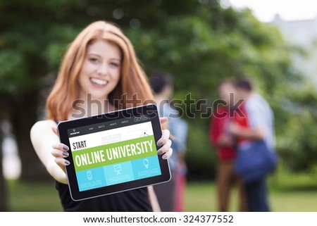 Online university interface against pretty student smiling at camera using tablet pc