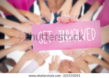 The word get involved and young woman holding blank card against oktoberfest graphics