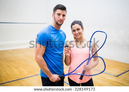 Happy couple after a squash game in the squash court