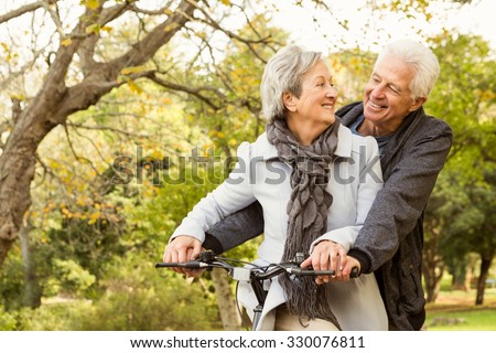 Senior couple in the park on an autumns day