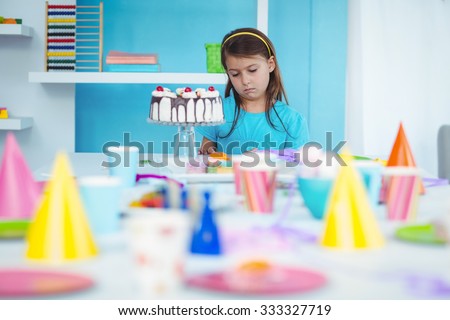 Sad kid alone at her birthday party