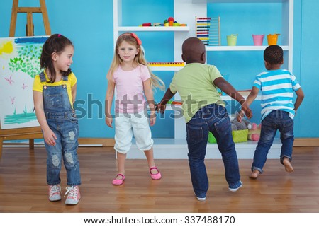 Happy kids playing games together in the bedroom