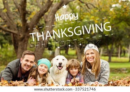 Happy thanksgiving against young family with a dog