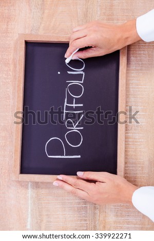 Chalkboard on table with portfolio text