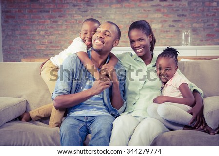 Happy family relaxing on the couch in living room