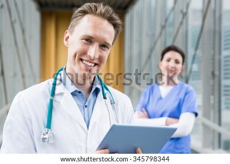 Doctor using his tablet pc at the hospital