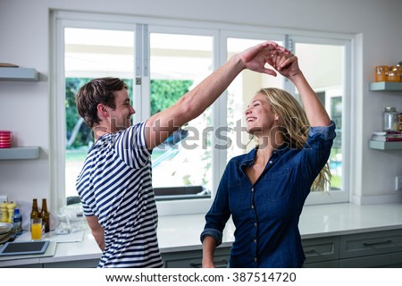 Cute couple dancing in the kitchen