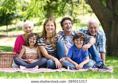 Smiling family having a picnic in the garden