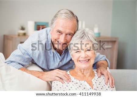 Portrait of romantic senior man with his wife at home