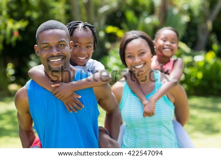 Happy family posing together at park