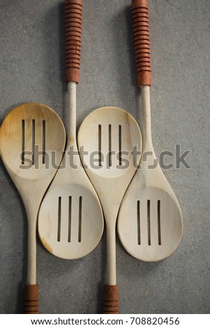 High angle view of spatulas arranged side by side on table