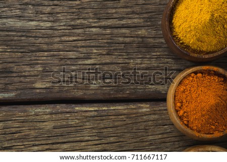 Close-up of spice powder on wooden table