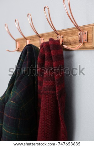 Close-up of warm clothing hanging on hook