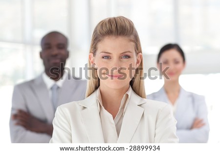 Young powerful businesswoman looking at camera