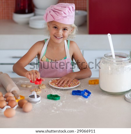 Beautiful young Girl Working in the Kitchen baking