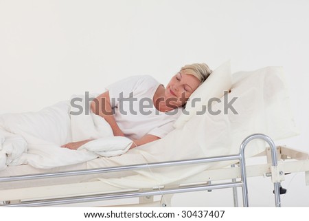 Elderly Patient lying in bed in a hospital