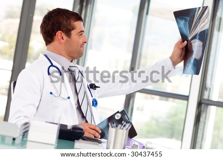 Young Doctor looking at an x-ray