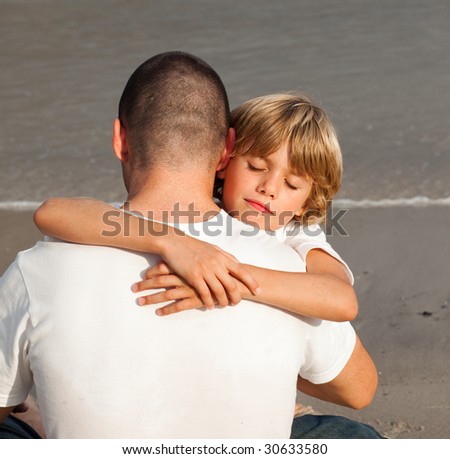 Portrait of a Young Boy Hugging his father