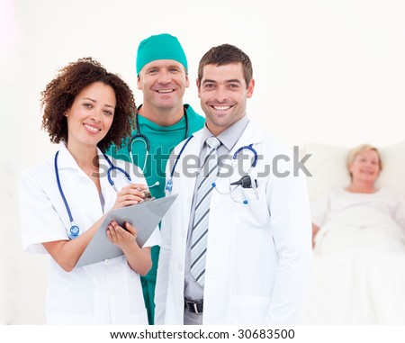 Young Surgeon with Doctors Looking after a senior Patient