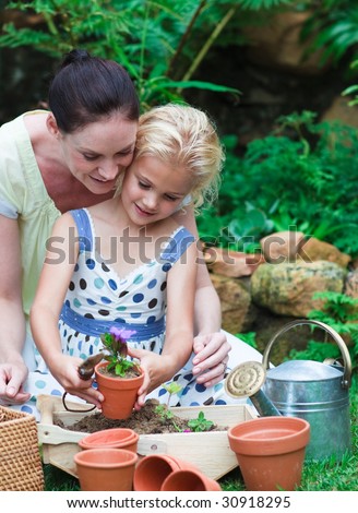 Mother and daughter gardening together