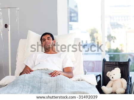 Hispanic patient resting in bed in hospital