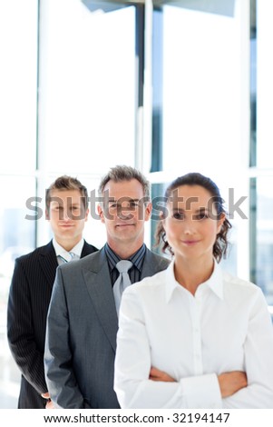 Mature businessman in a line with his business team with copy-right
